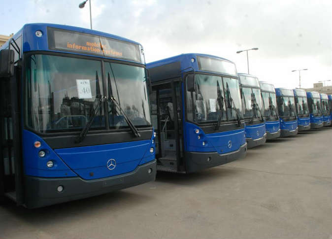 Cairo public bus with passengers boarding using modern electronic payment card system