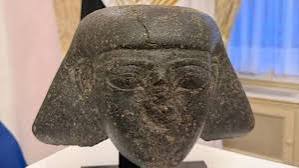 Ancient Egyptian stone head artifact from King Thutmose III era being officially returned to Egypt