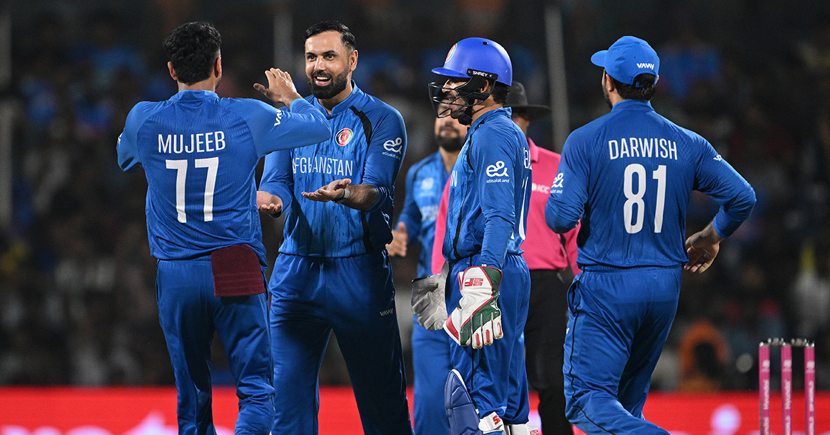 Afghan cricket player Ibrahim Zadran celebrating with bat raised after scoring 95 runs