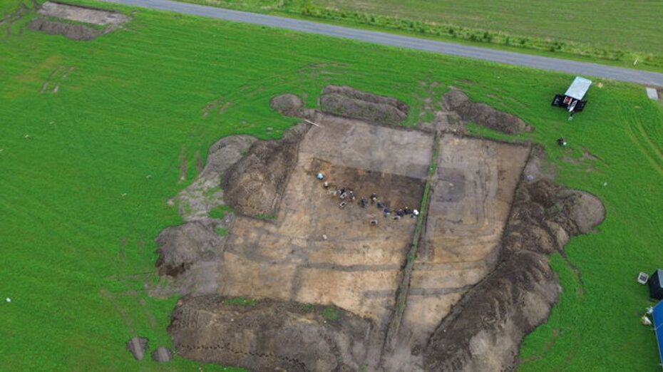 Ancient Iron Age temple archaeological site in Denmark showing post holes and foundation remains
