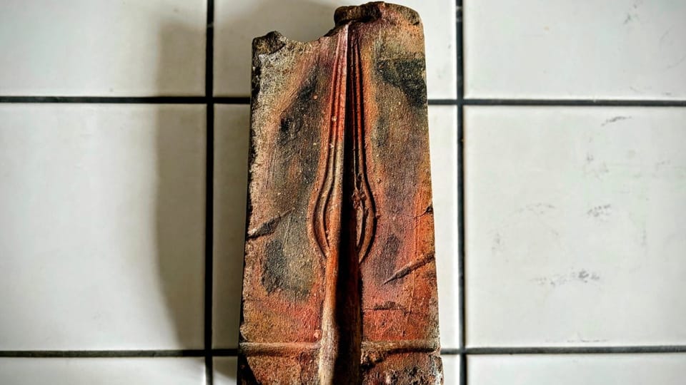 Ancient carved stone mould showing negative impression cavity for casting Bronze Age spearhead