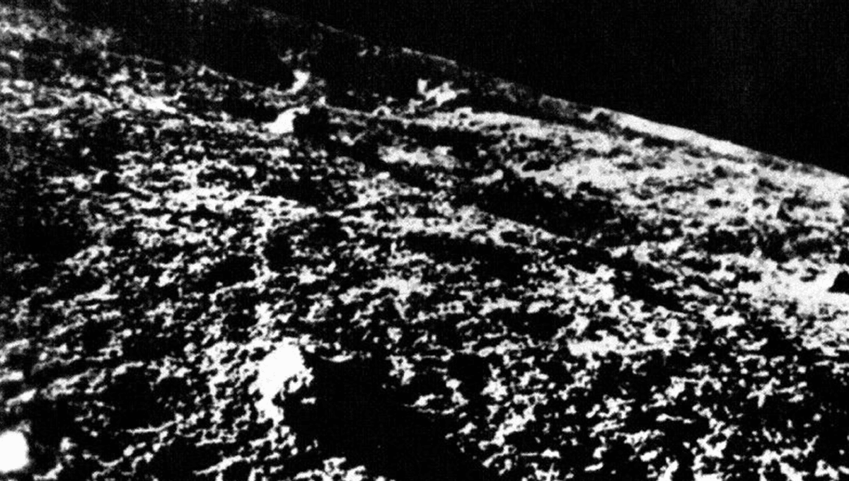 Grainy black and white photograph showing the Moon's rocky surface taken by Luna 9 spacecraft in 1966