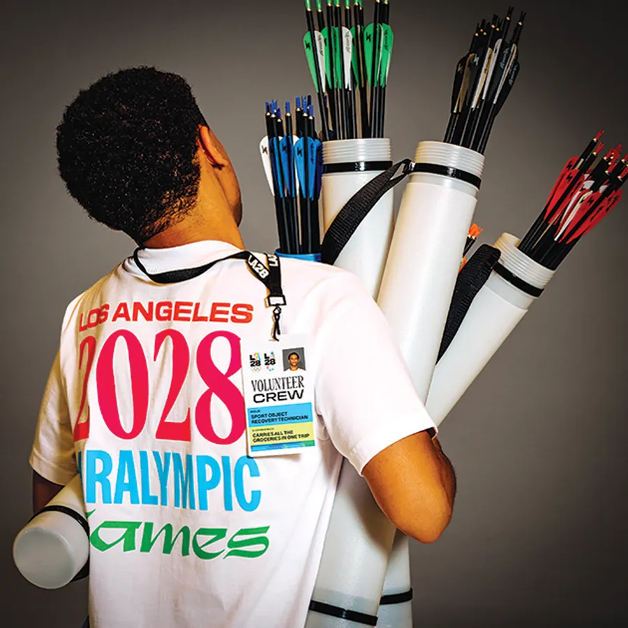 Volunteers in blue LA28 shirts preparing to support the 2028 Olympic Games in Los Angeles