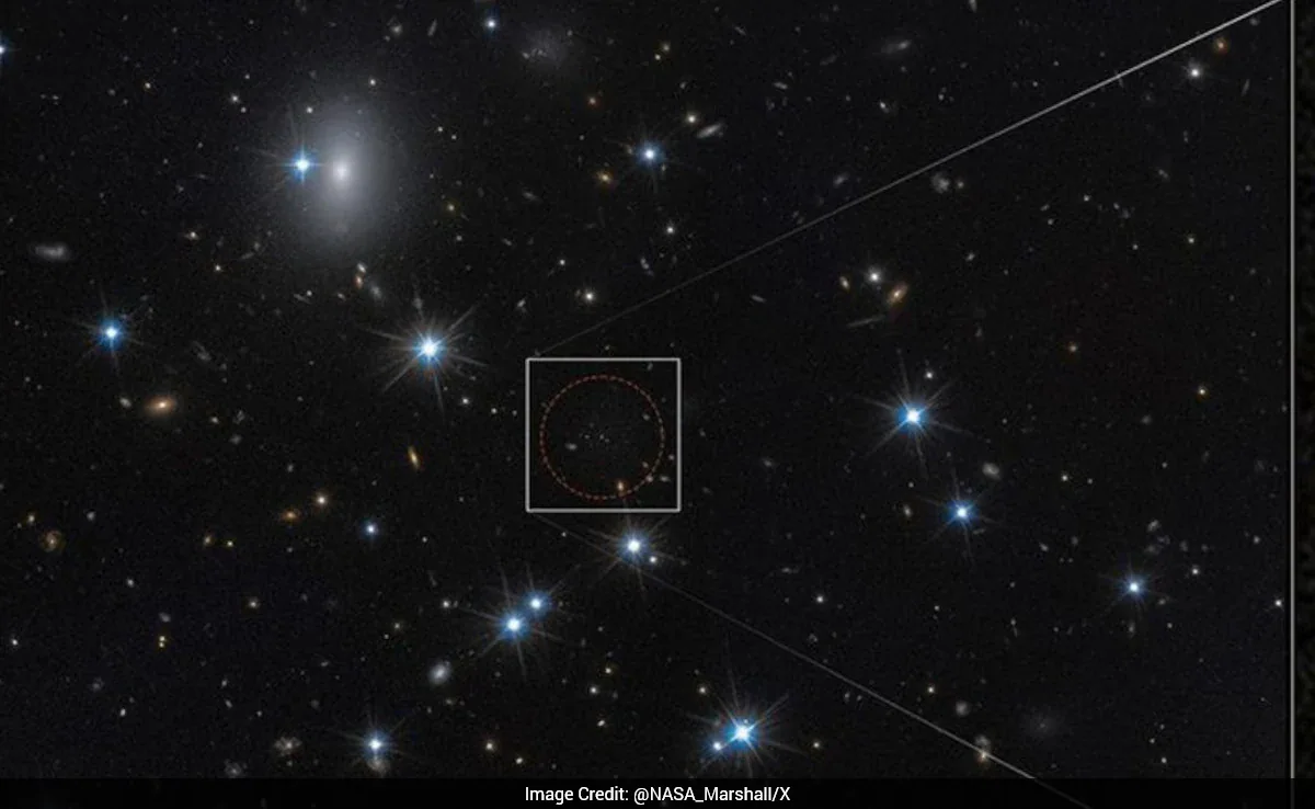 Hubble Space Telescope image showing four ancient star clusters in distant Perseus galaxy