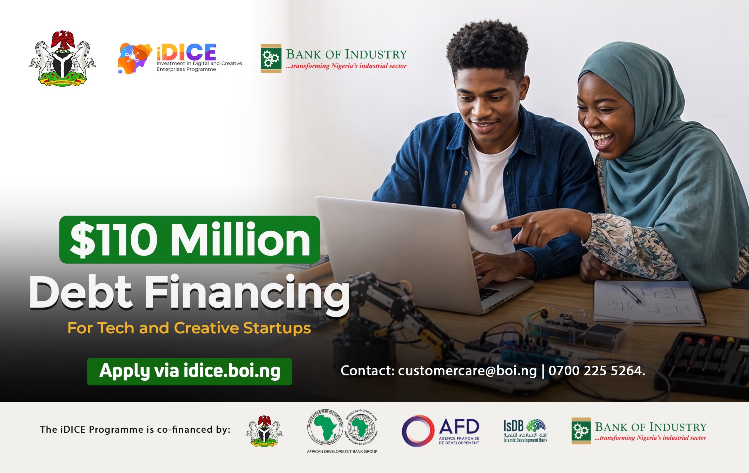 Nigerian tech entrepreneurs collaborating at modern workspace with laptops and smartphones