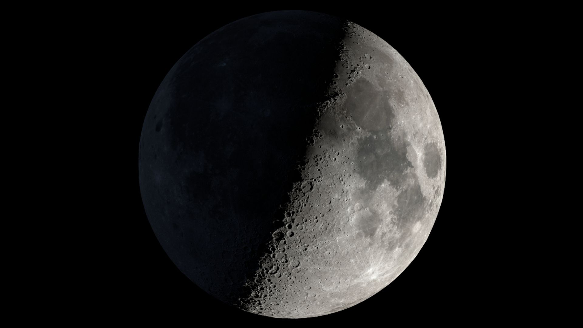 First quarter moon showing illuminated craters Eudoxus, Aristoteles, and Cassini with dramatic shadows