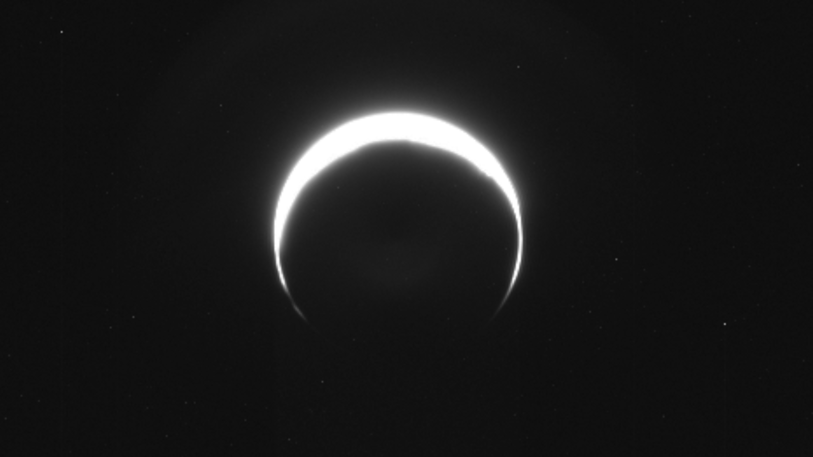 NASA Spacecraft Captures Rare Crescent Mars Image