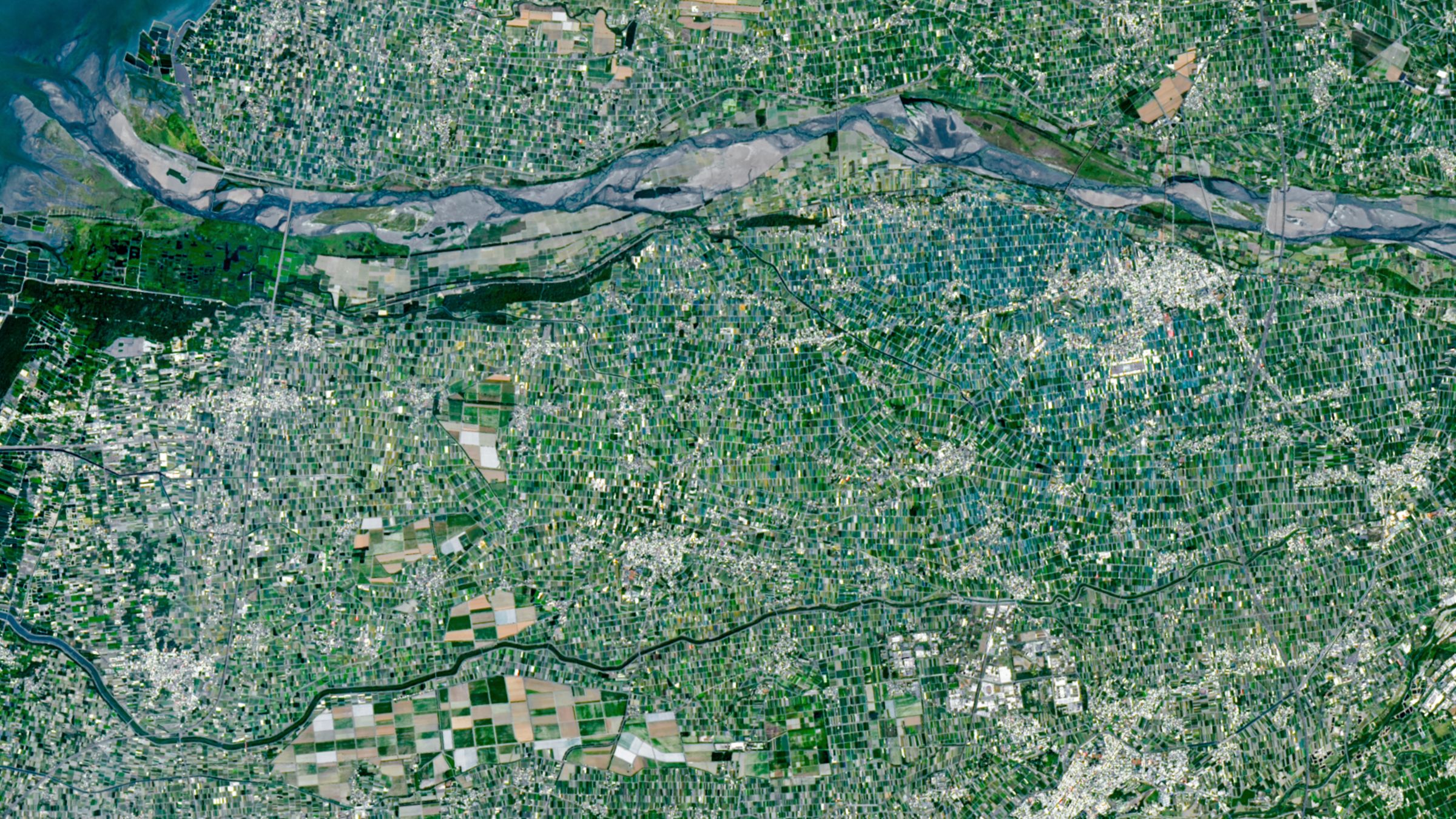 Satellite view of colorful patchwork farmland in Taiwan's Yunlin County along Zhuoshui River