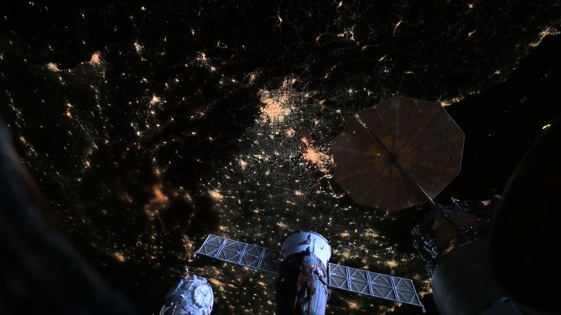 Time-lapse view from space showing twinkling fireworks across Beijing's illuminated highways during Lunar New Year