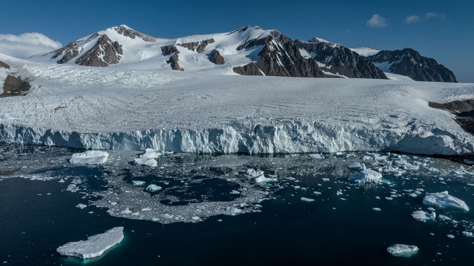 Torpedo-shaped Argo float robot diving in Antarctic ocean waters collecting climate data