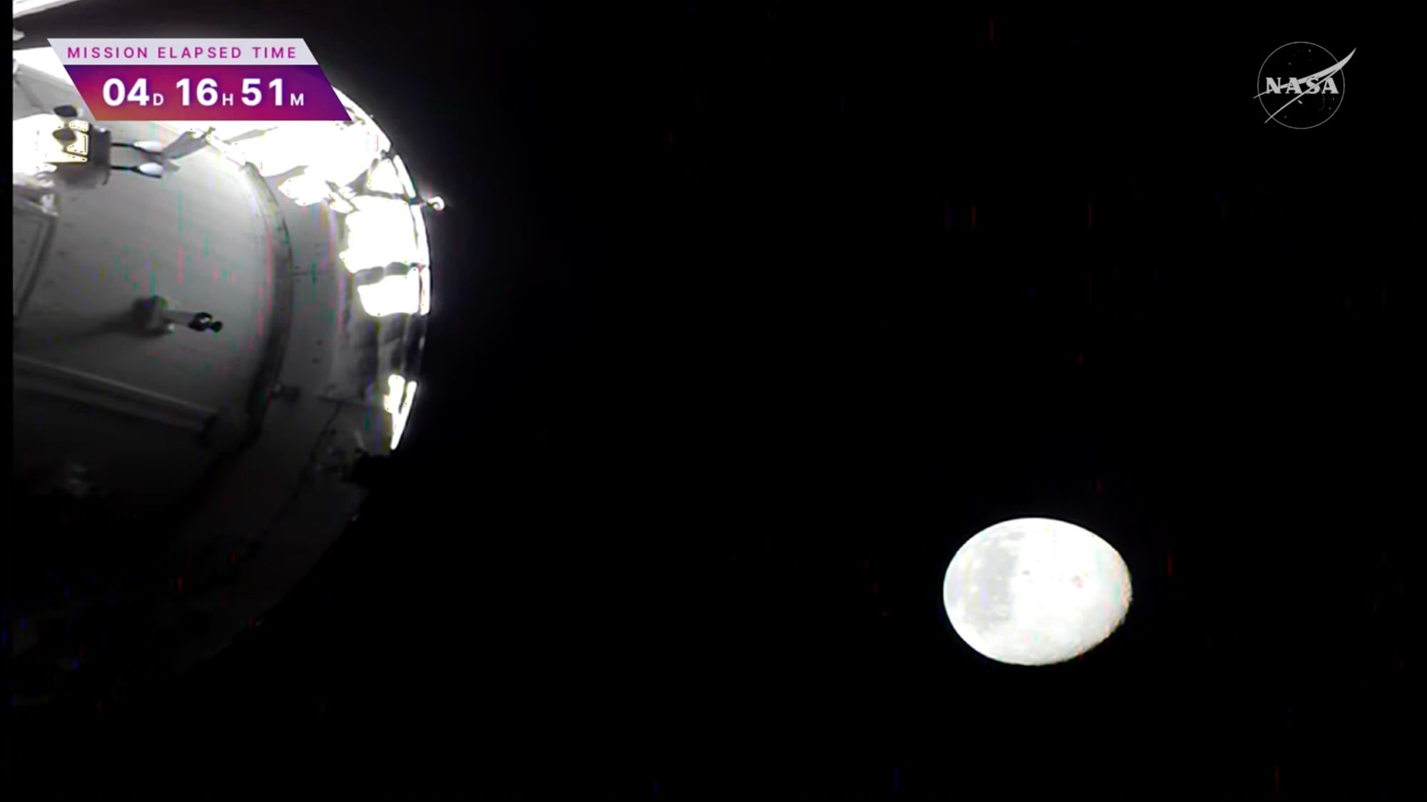 Artemis 2 Orion capsule orbiting the moon against the darkness of space