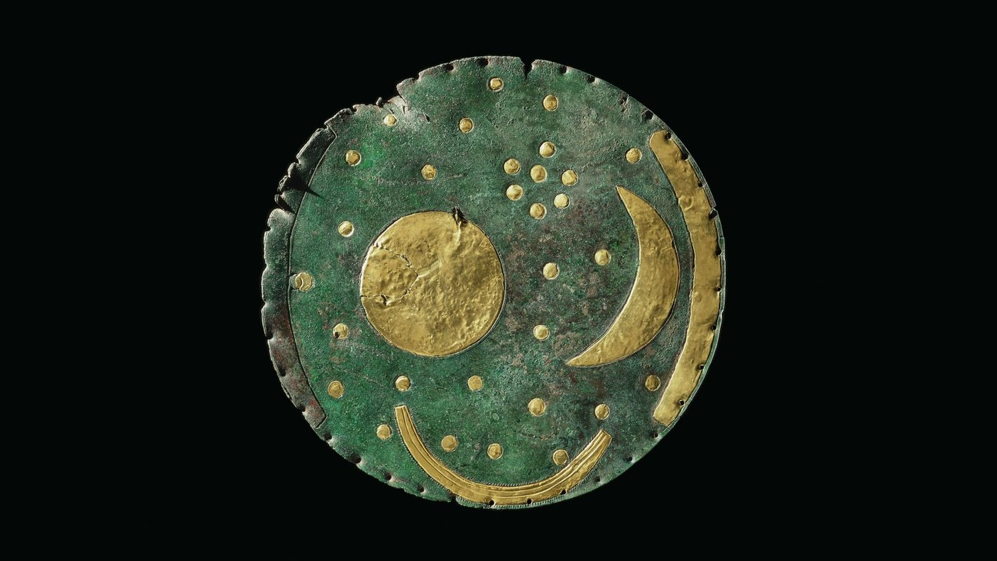 Bronze disc with gold inlays showing moon, sun, and stars from 3,800 years ago