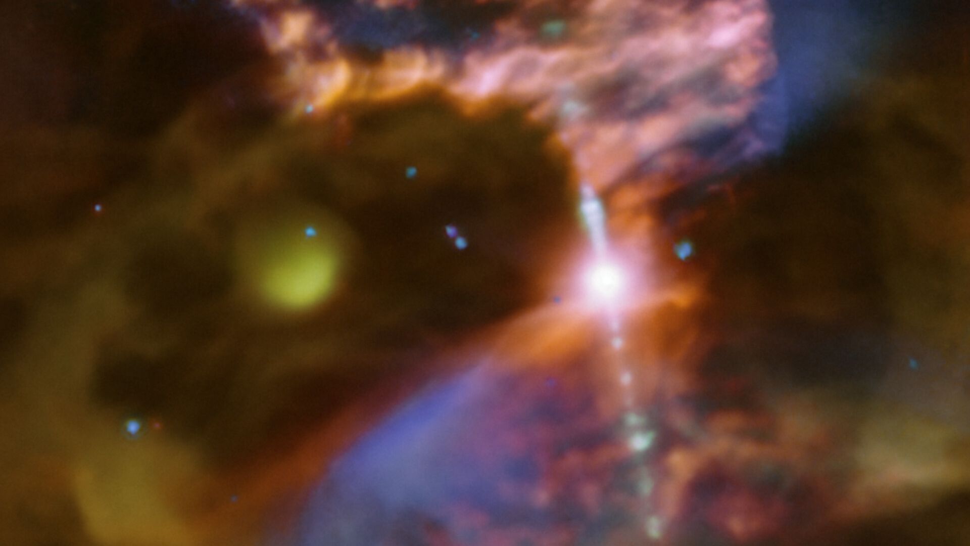 ** Glowing green and yellow nebula showing newborn star Ve 7-27 surrounded by supernova remnant debris