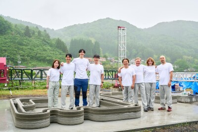 3D construction printer creating curved concrete walls for modern building in Malaysia