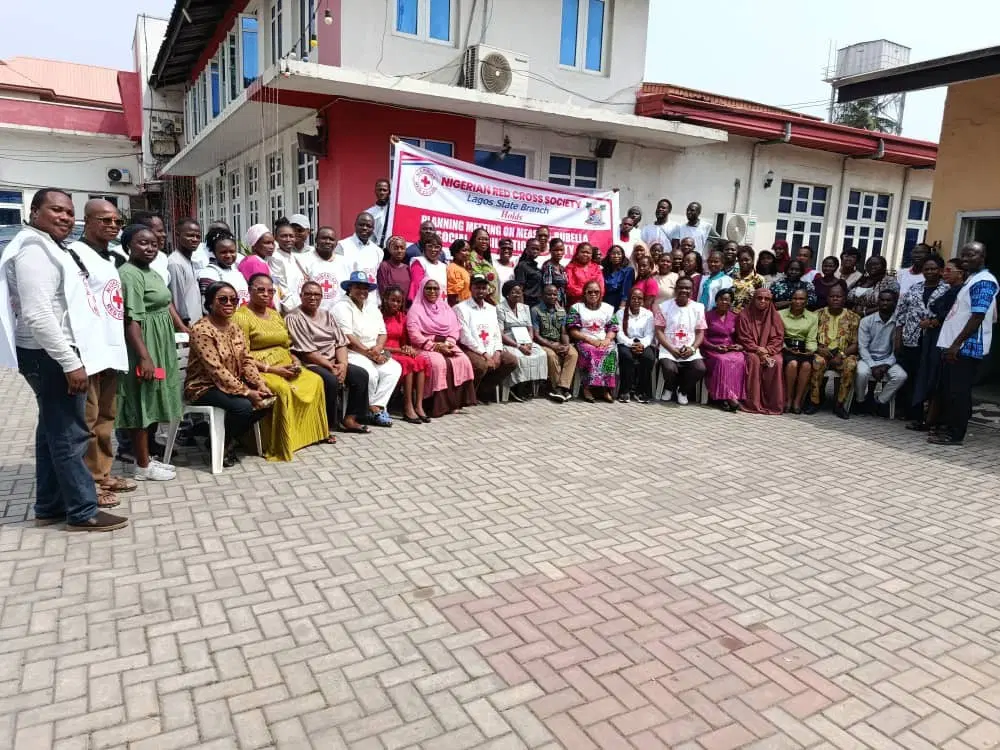Red Cross volunteers preparing for door-to-door vaccination awareness campaign in Lagos, Nigeria