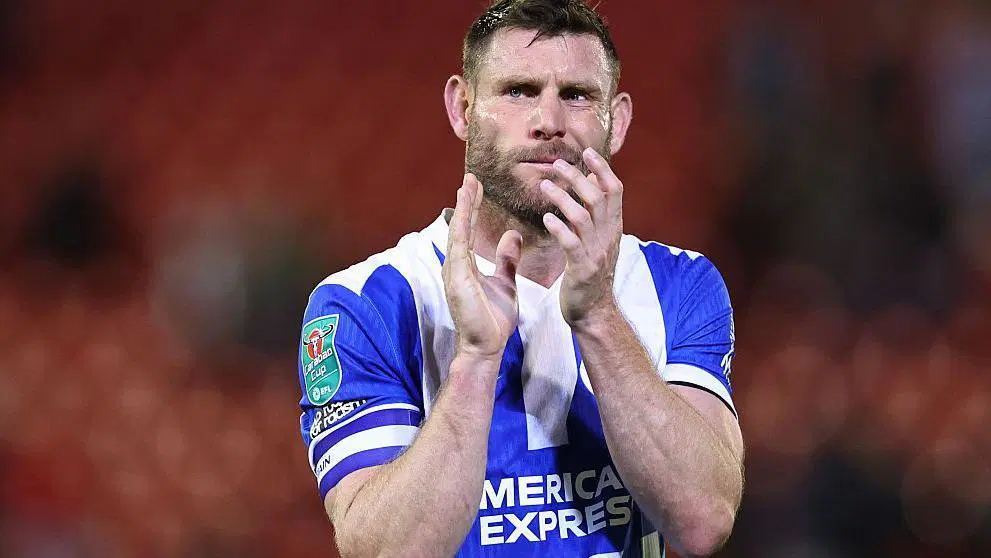 Brighton midfielder James Milner in blue and white striped jersey during Premier League match