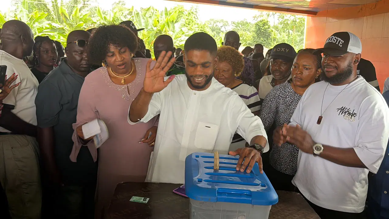 ** Nigerian voters waiting in line at polling station during peaceful Ebonyi State local elections