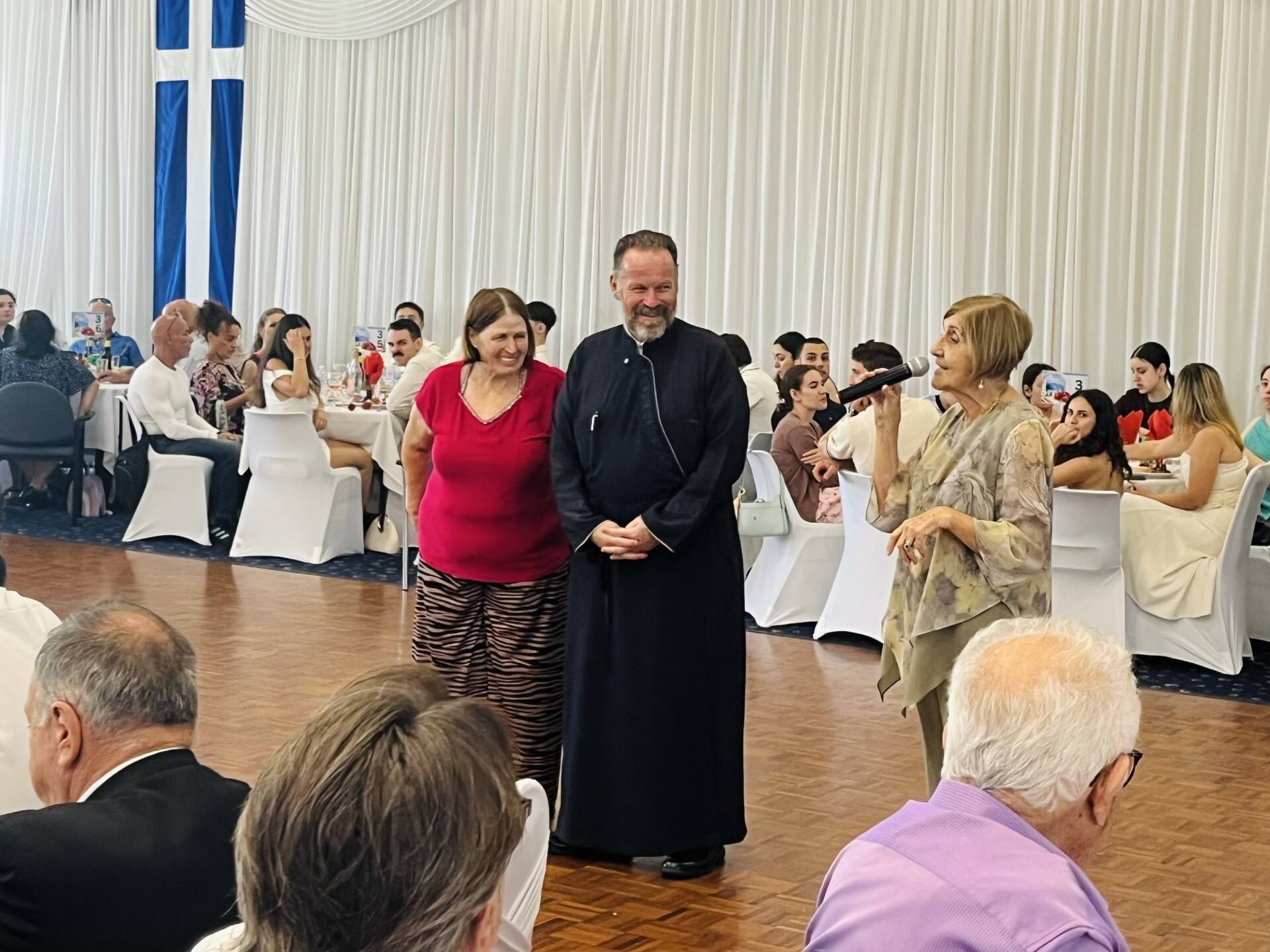 Gold Coast Greek Orthodox parishioners celebrating Easter Sunday with traditional feast and dancing