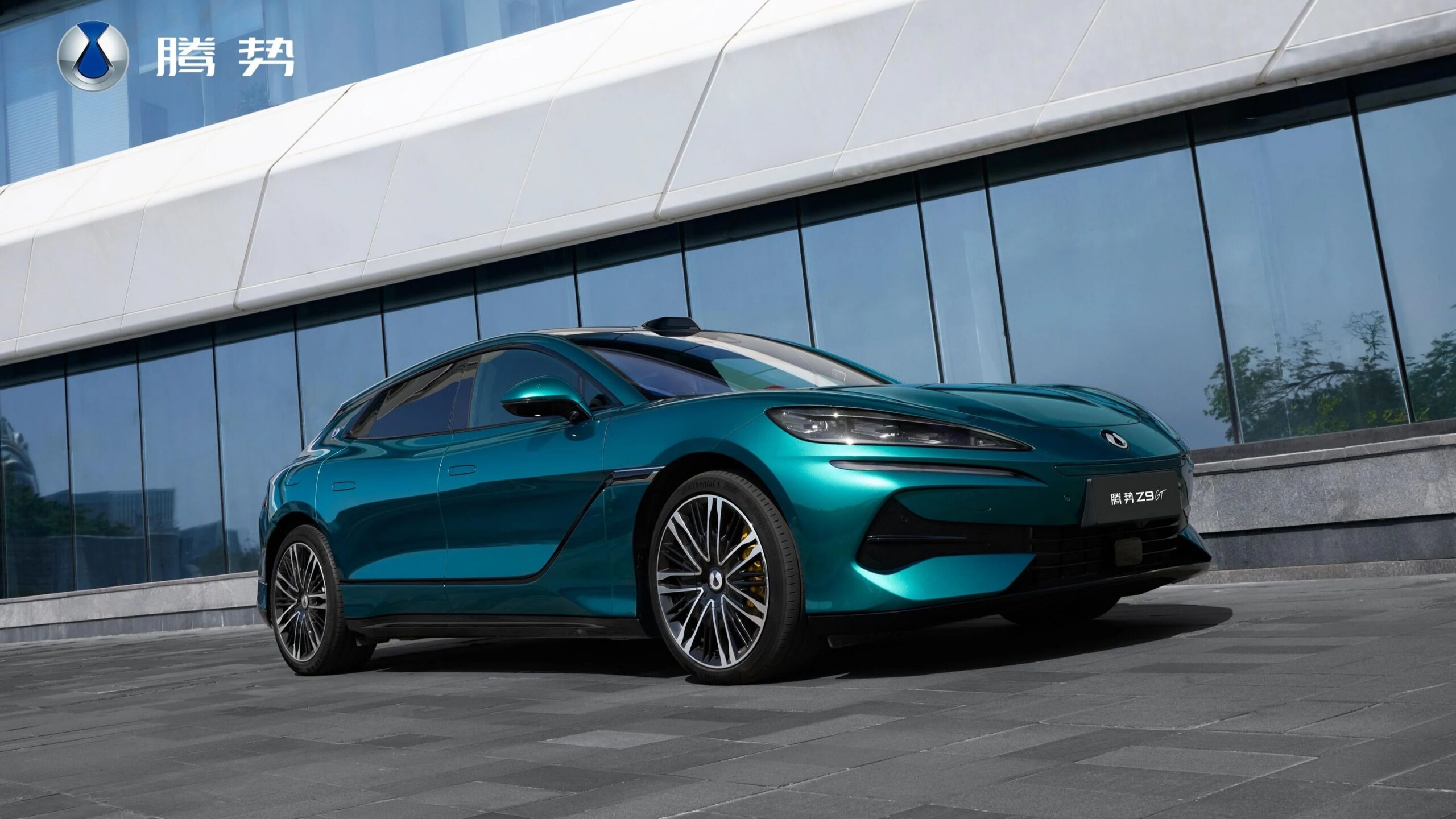 Sleek silver Denza Z9 luxury electric sedan displayed at automotive showcase