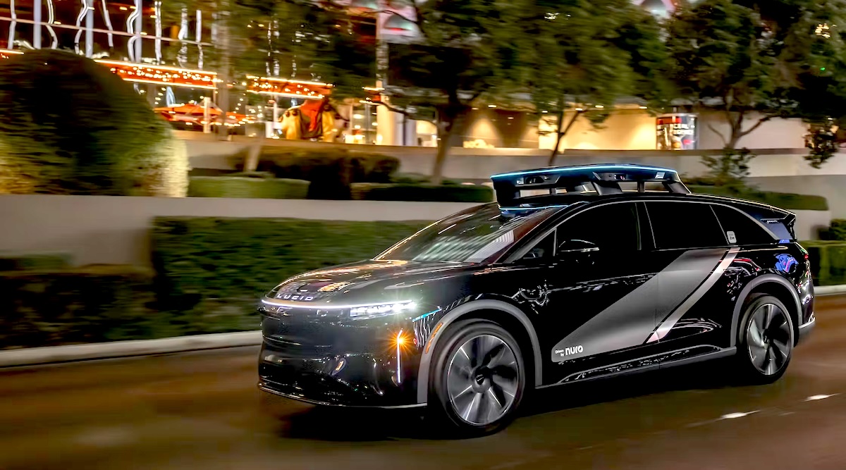 Sleek silver Lucid Gravity electric SUV configured as autonomous robotaxi with LED displays