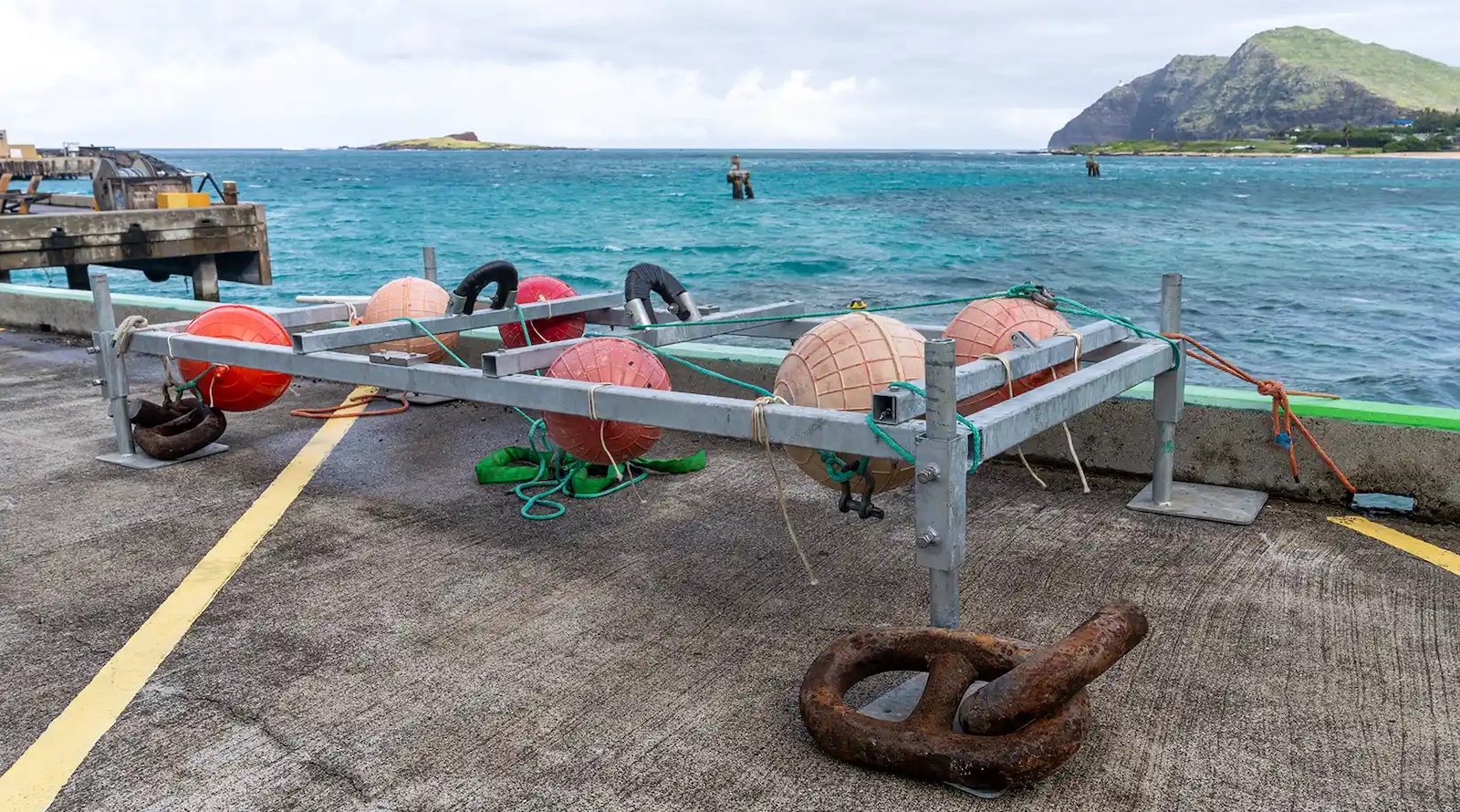 TV-sized wave energy converter flap device floating in ocean water off Hawaii coast