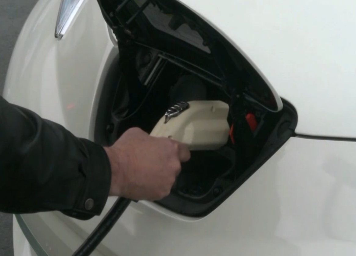 Electric vehicle charging station with four ports near waterfront marina in Greilickville Michigan