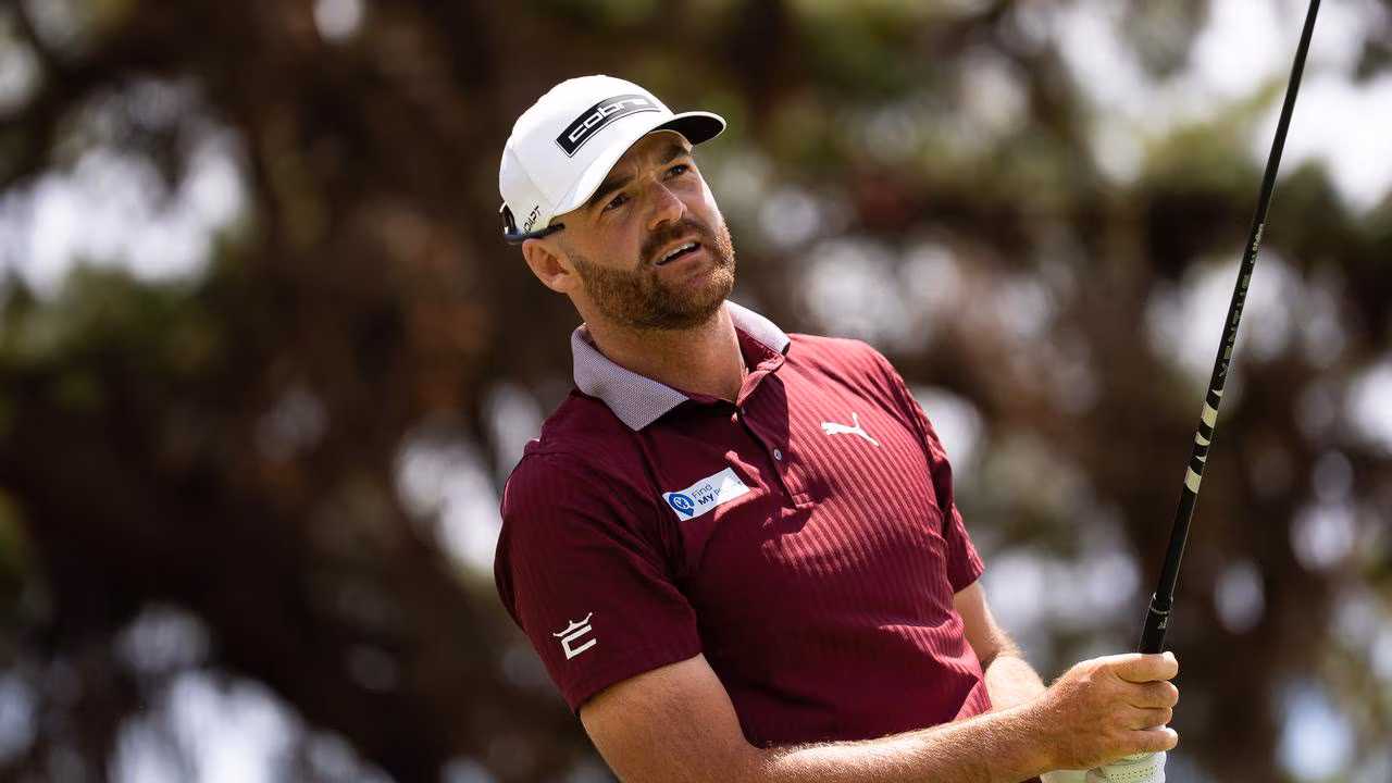 Haydn Barron celebrates on golf course after winning his first professional tournament