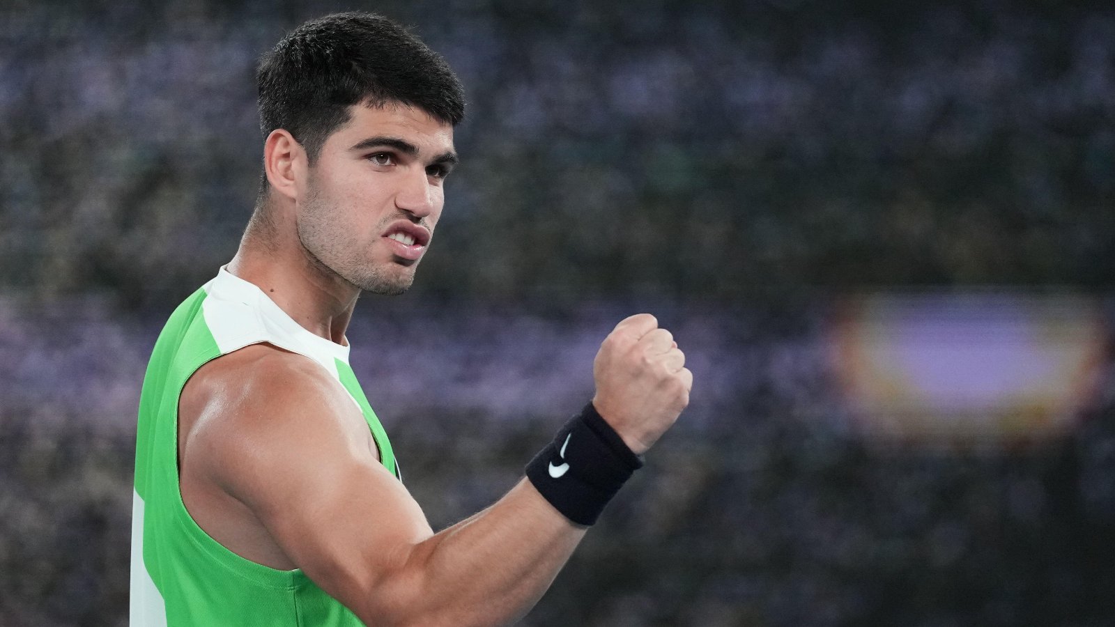 Carlos Alcaraz celebrating on court at Australian Open after reaching his first semifinal