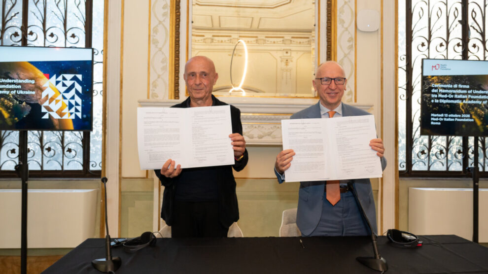 Italian and Ukrainian officials shaking hands at diplomatic cooperation agreement signing ceremony in Rome