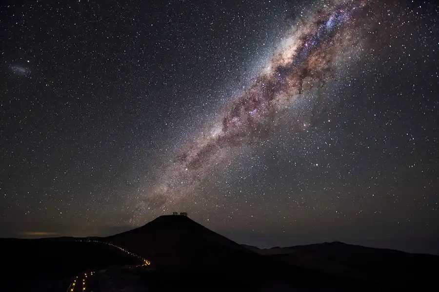 Milky Way galaxy arching over Chile's Paranal Observatory against pristine dark desert sky