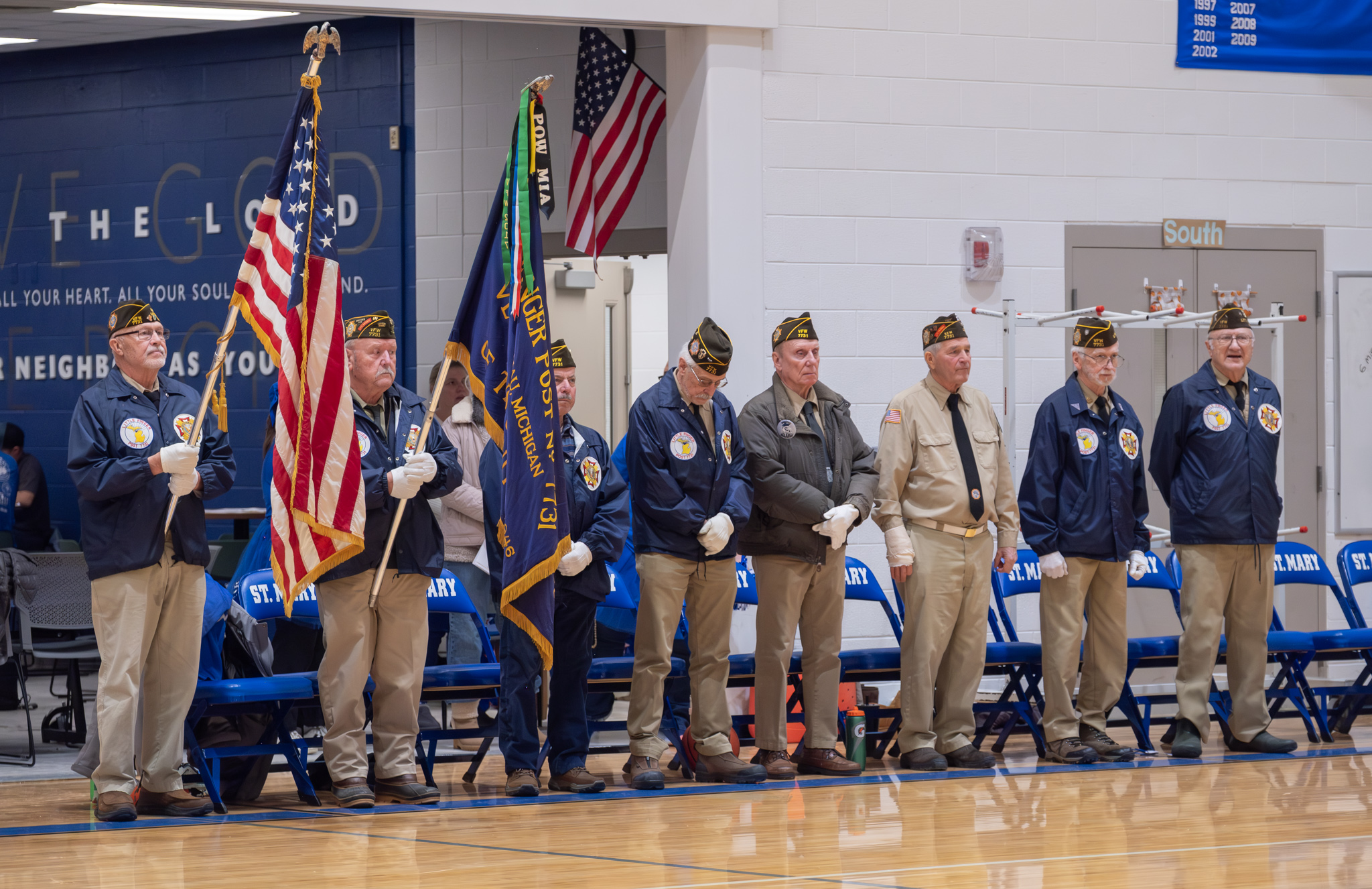 Local veterans standing together at St. Mary School fundraiser event