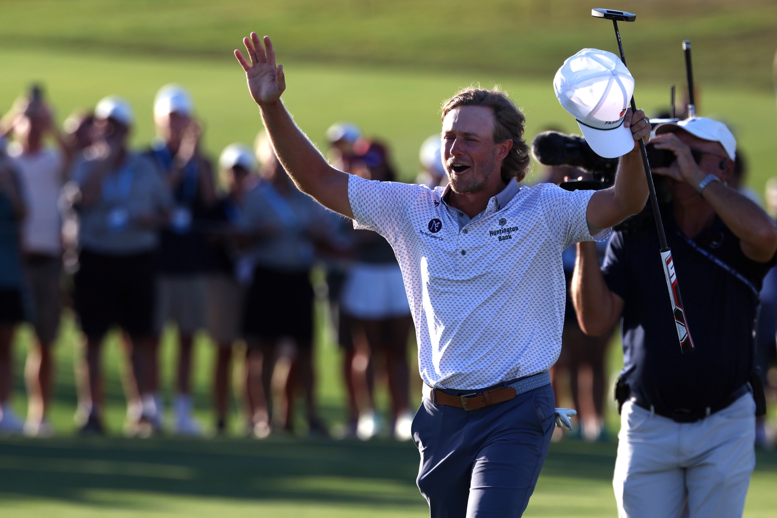 Austin Smotherman celebrates on golf course after winning first PGA Tour title