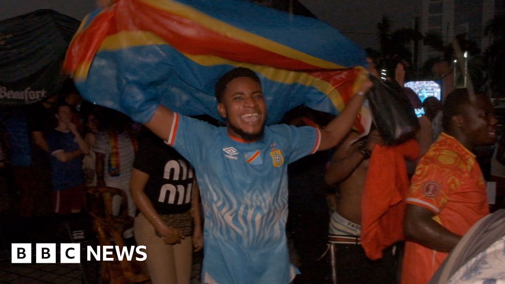 Celebrating football fans in Kinshasa streets after DR Congo World Cup qualification victory