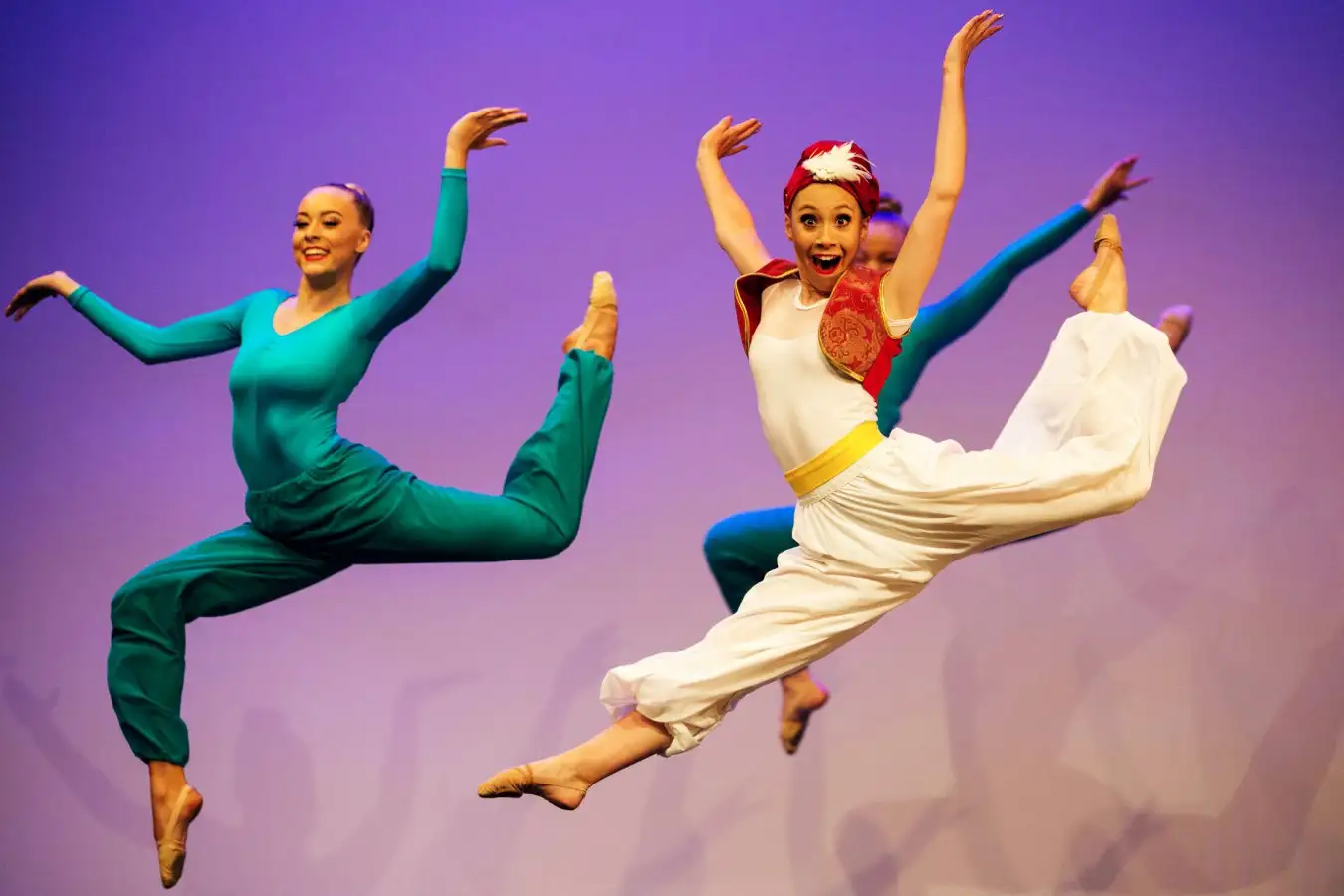 Theater audience enjoying live performance, representing health benefits of arts engagement