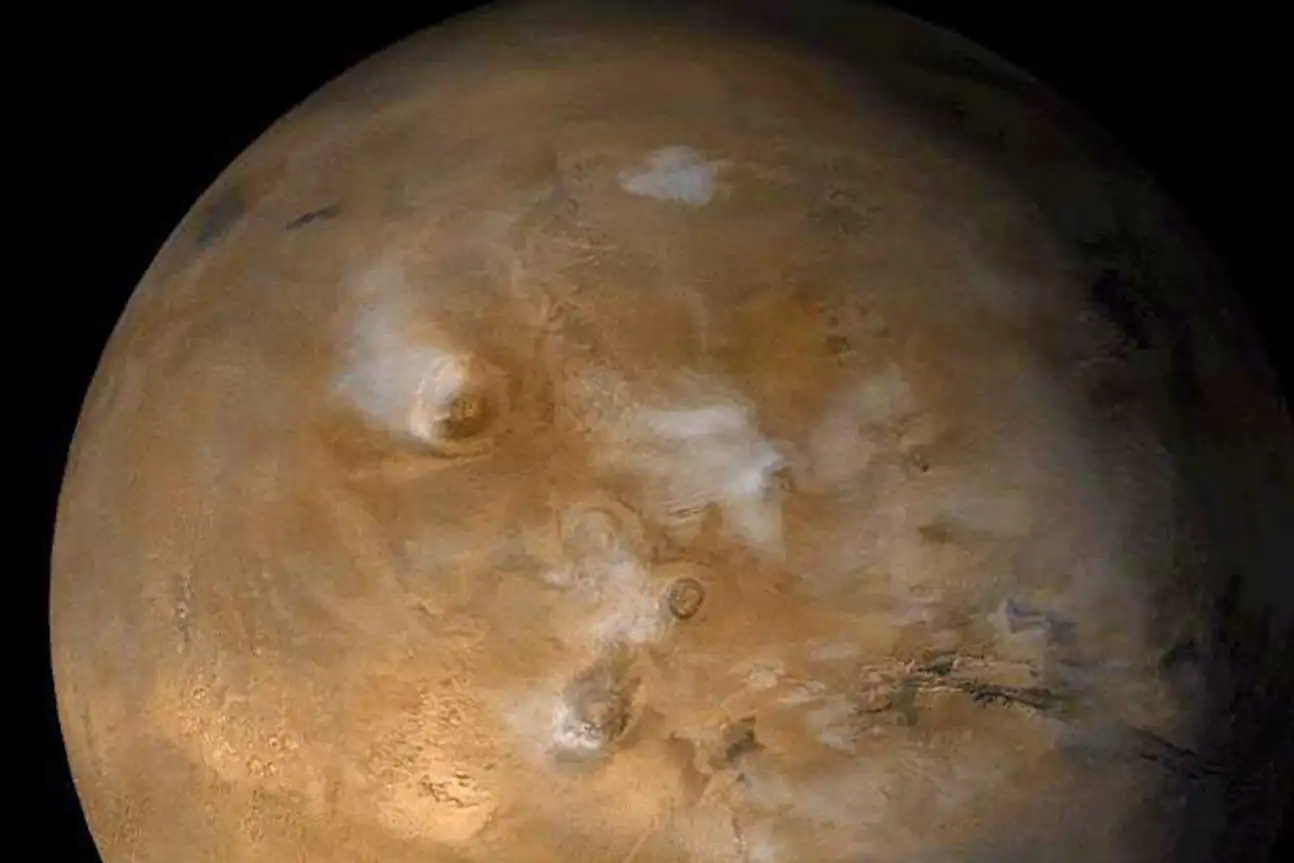 Artist rendering of Mars and Earth in space showing gravitational influence between planets