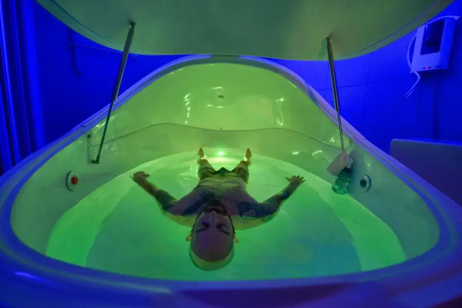 Mobile floatation tank therapy pods inside shipping container being deployed for disaster relief