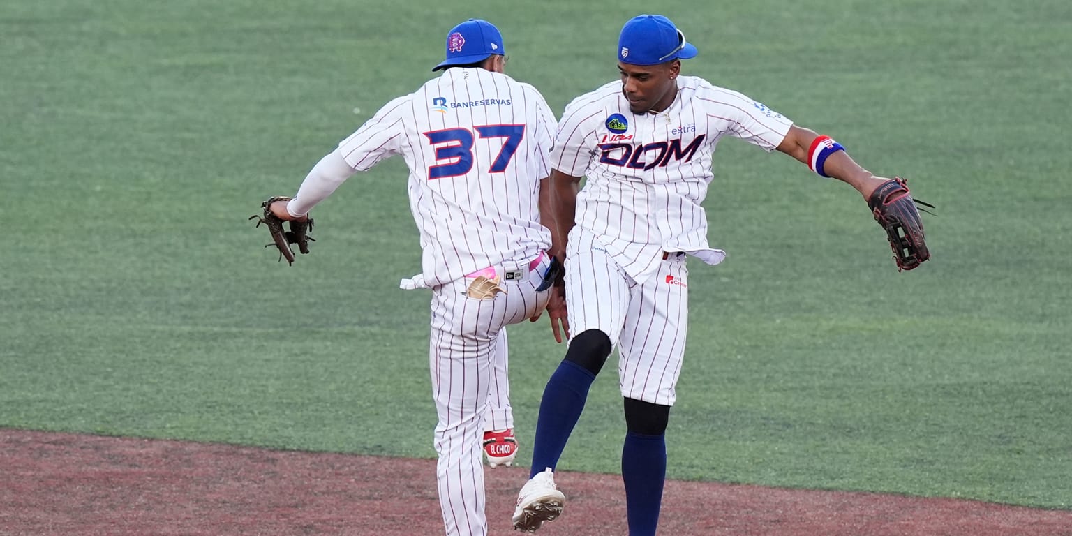 Baseball players celebrating on field during Caribbean Series tournament game in Guadalajara stadium