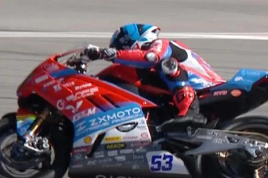 ZXMOTO racing motorcycle crossing finish line at World Superbike Championship in Portugal