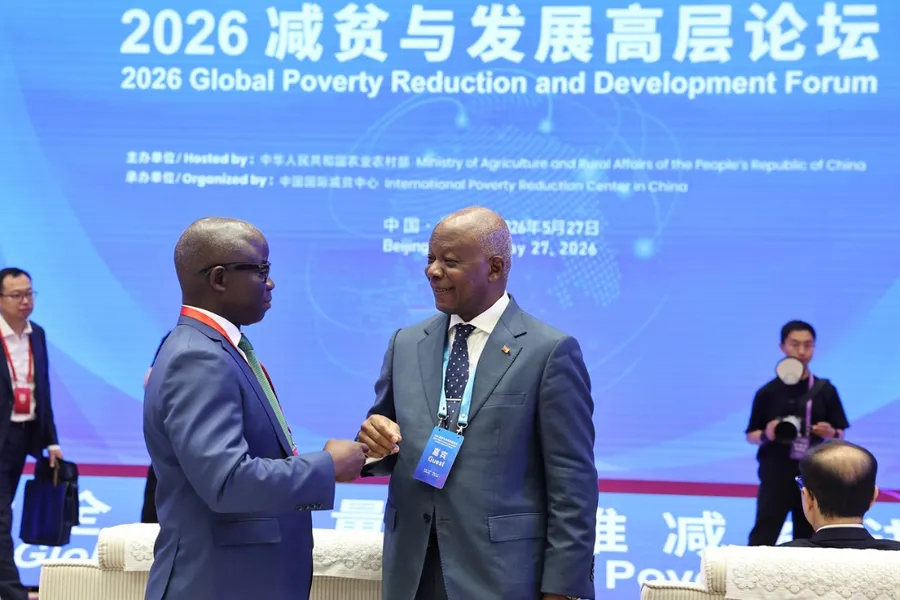 ** Representatives from multiple countries gathering at international development forum in Beijing discussing poverty reduction strategies
