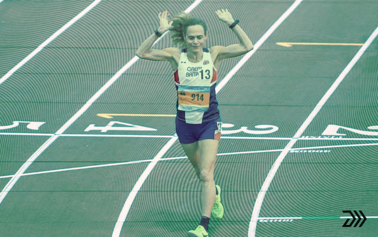Clare Elms crossing finish line at outdoor track competition in London