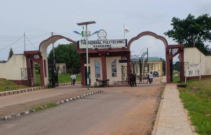 Modern university building in Nigeria with students studying mining and engineering technology