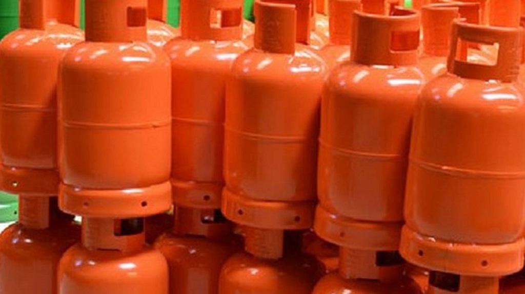 Nigerian family cooking with clean liquefied petroleum gas in modern kitchen