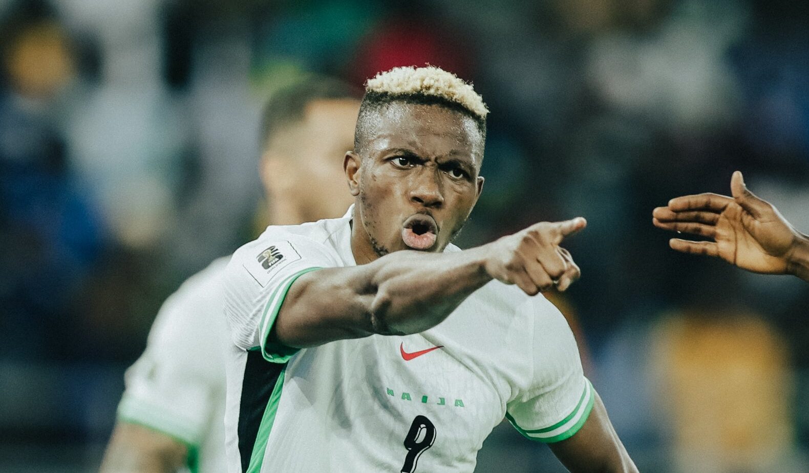 Victor Osimhen celebrating in Nigeria's green Super Eagles jersey after scoring a goal