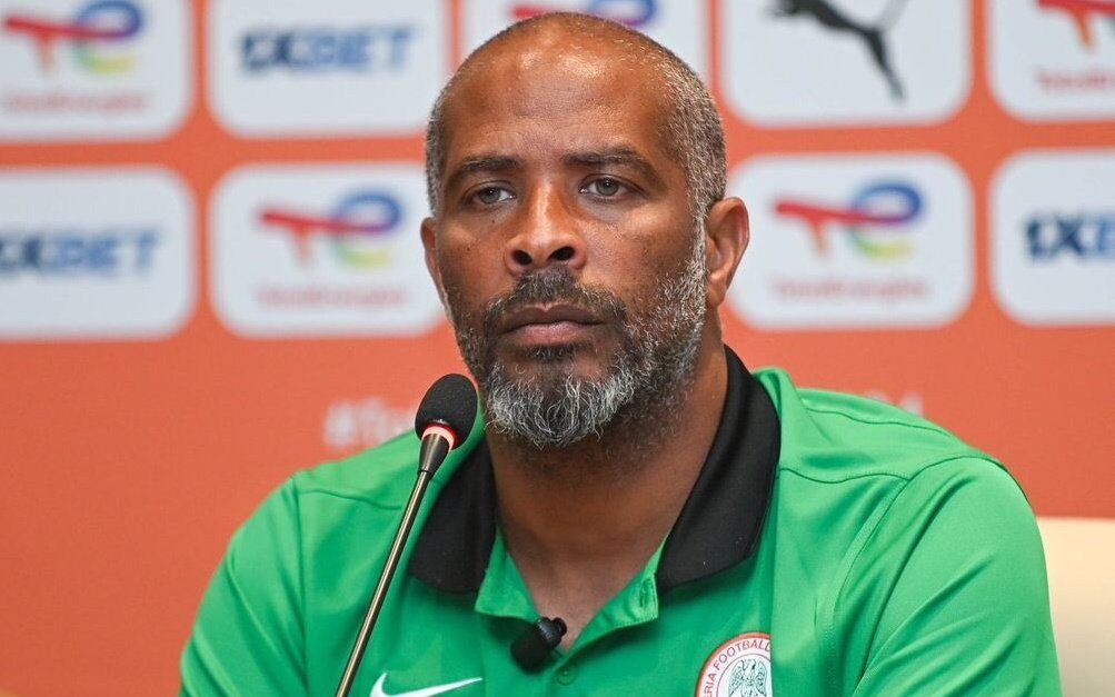Nigeria Super Eagles Head Coach Eric Chelle standing on sideline during international match