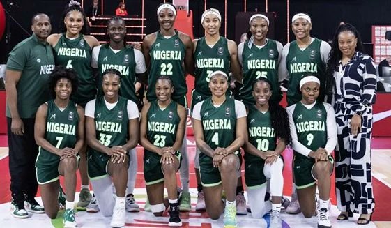 Nigerian D'Tigress women's basketball team celebrating their fifth consecutive AfroBasket championship victory