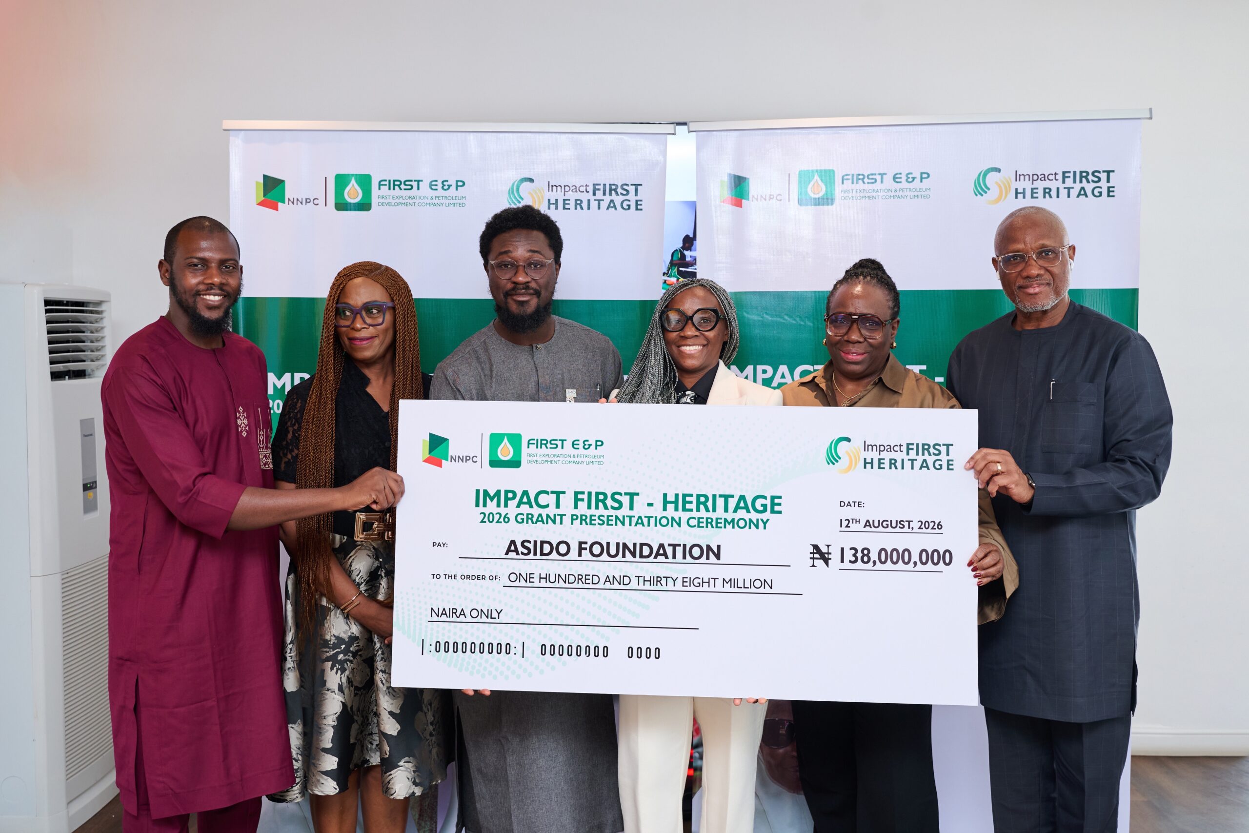 Nigerian healthcare workers and community leaders celebrating multi-year nonprofit funding announcement in Lagos