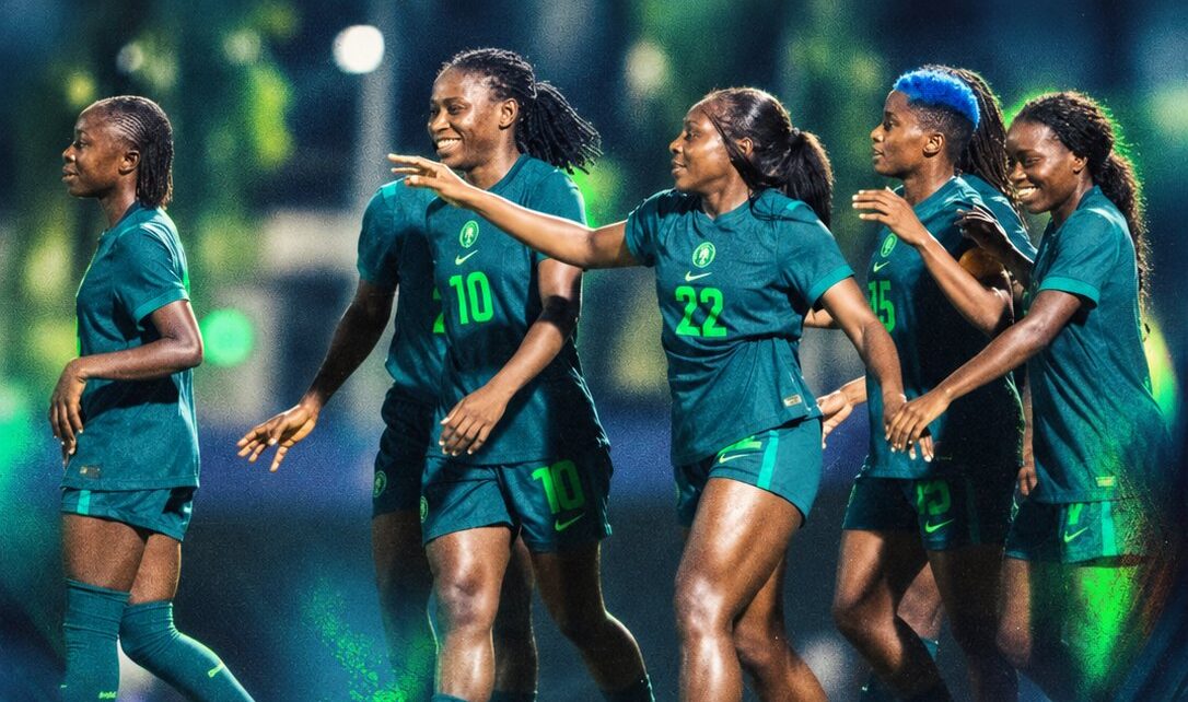 Nigerian women's soccer team Super Falcons celebrating during Olympic qualifying match at stadium