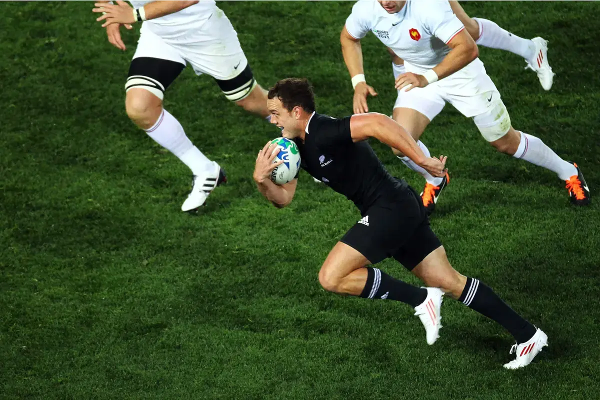 Israel Dagg in New Zealand All Blacks uniform running with rugby ball during match