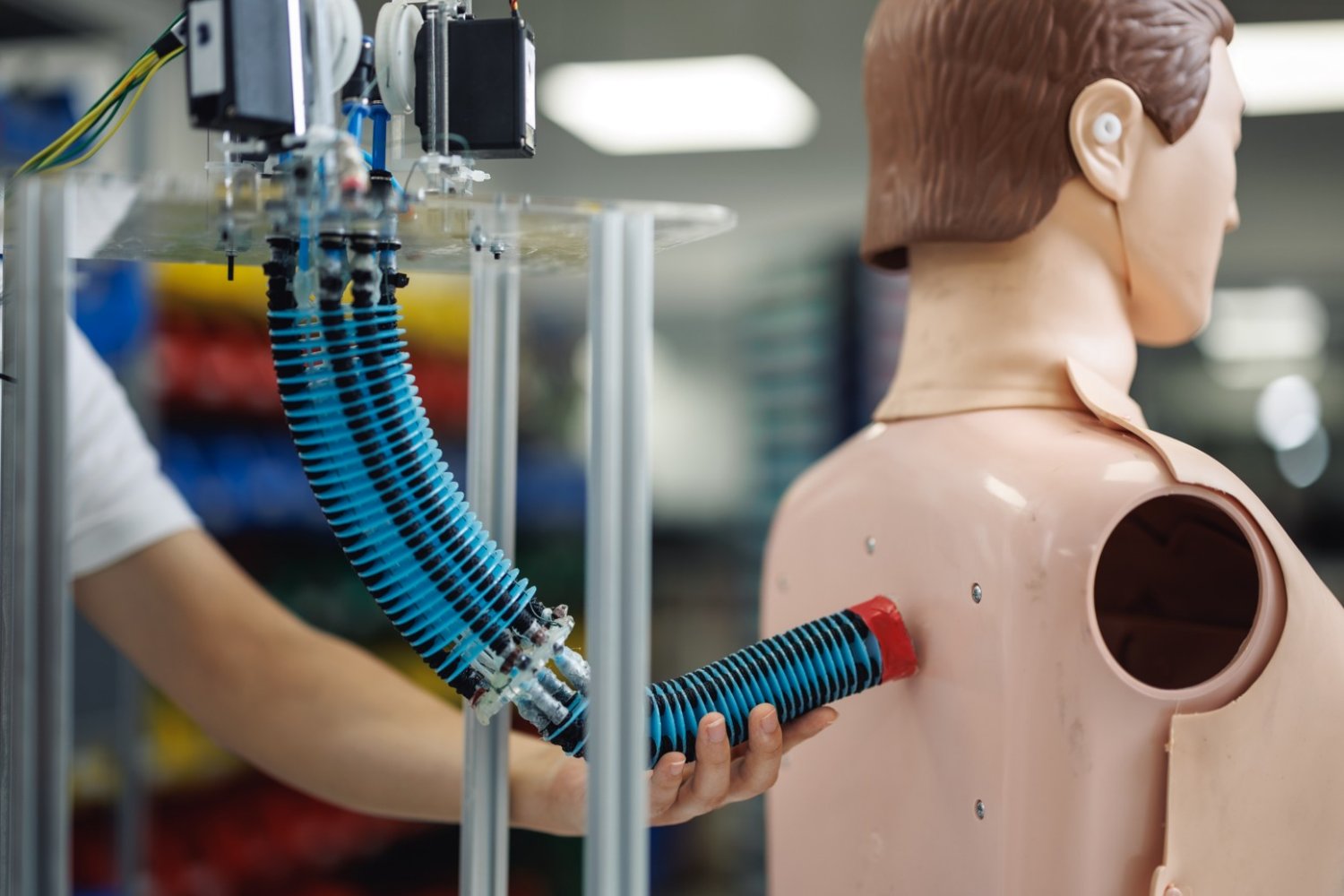 Flexible soft robotic arm made of rubber bending smoothly to grasp an object