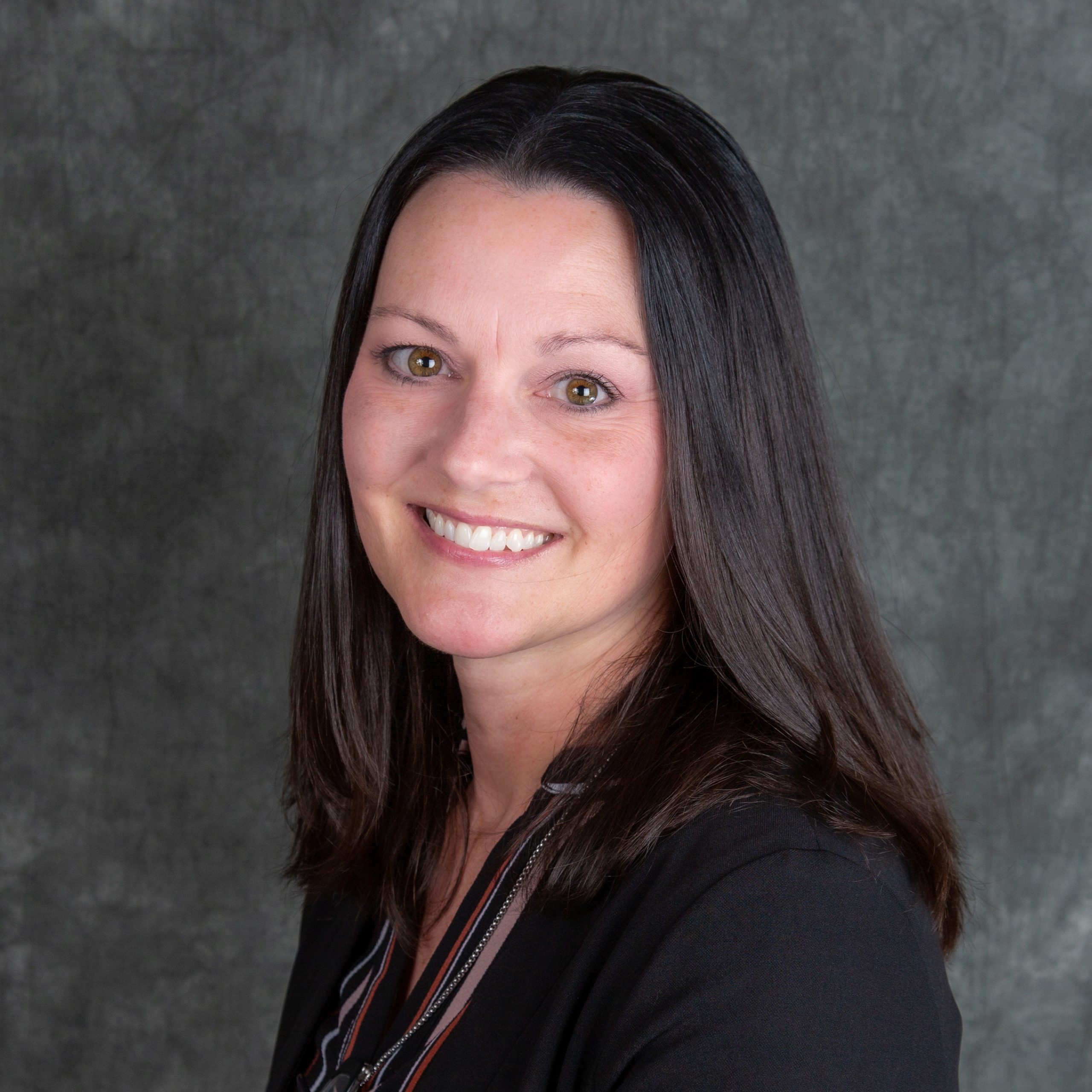 Jennifer Ferris smiling in professional attire at UT Health Sciences Knoxville campus